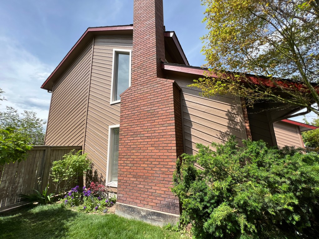 Side view of house with brick chimney