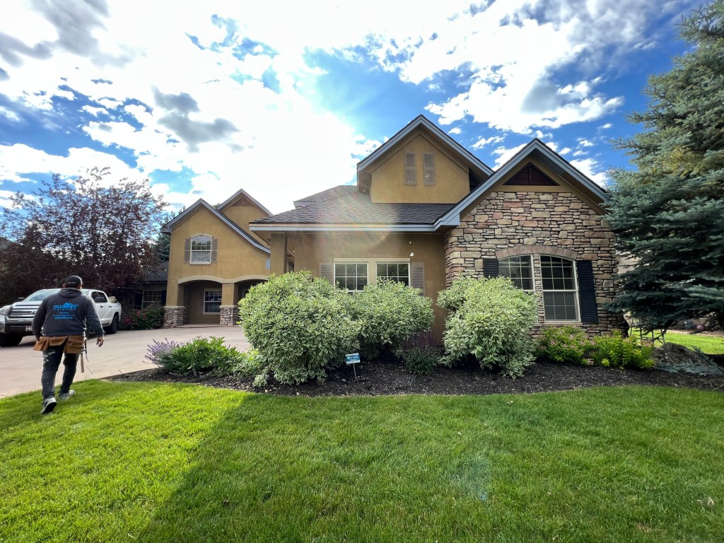 Large landscaped two-story home front yard