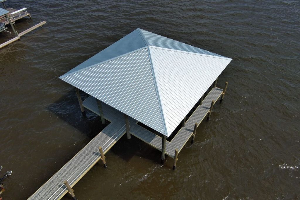 Covered wooden dock structure over water