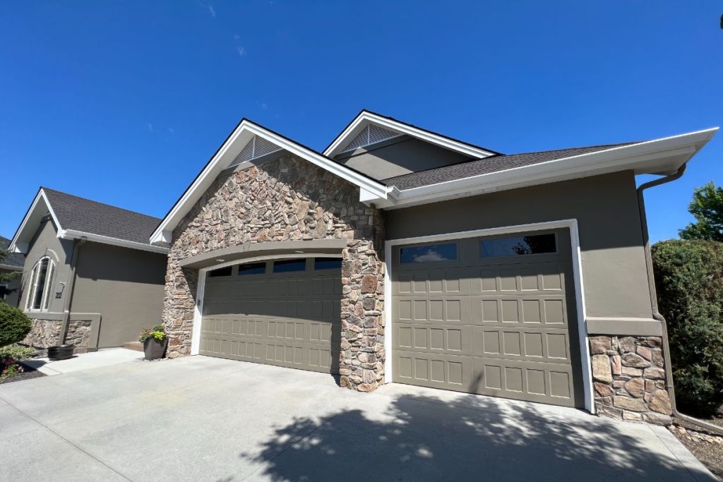 Front view of house with stone accents and double garage