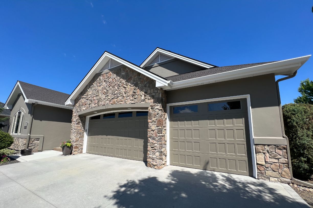 Front view of house with stone accents and double garage