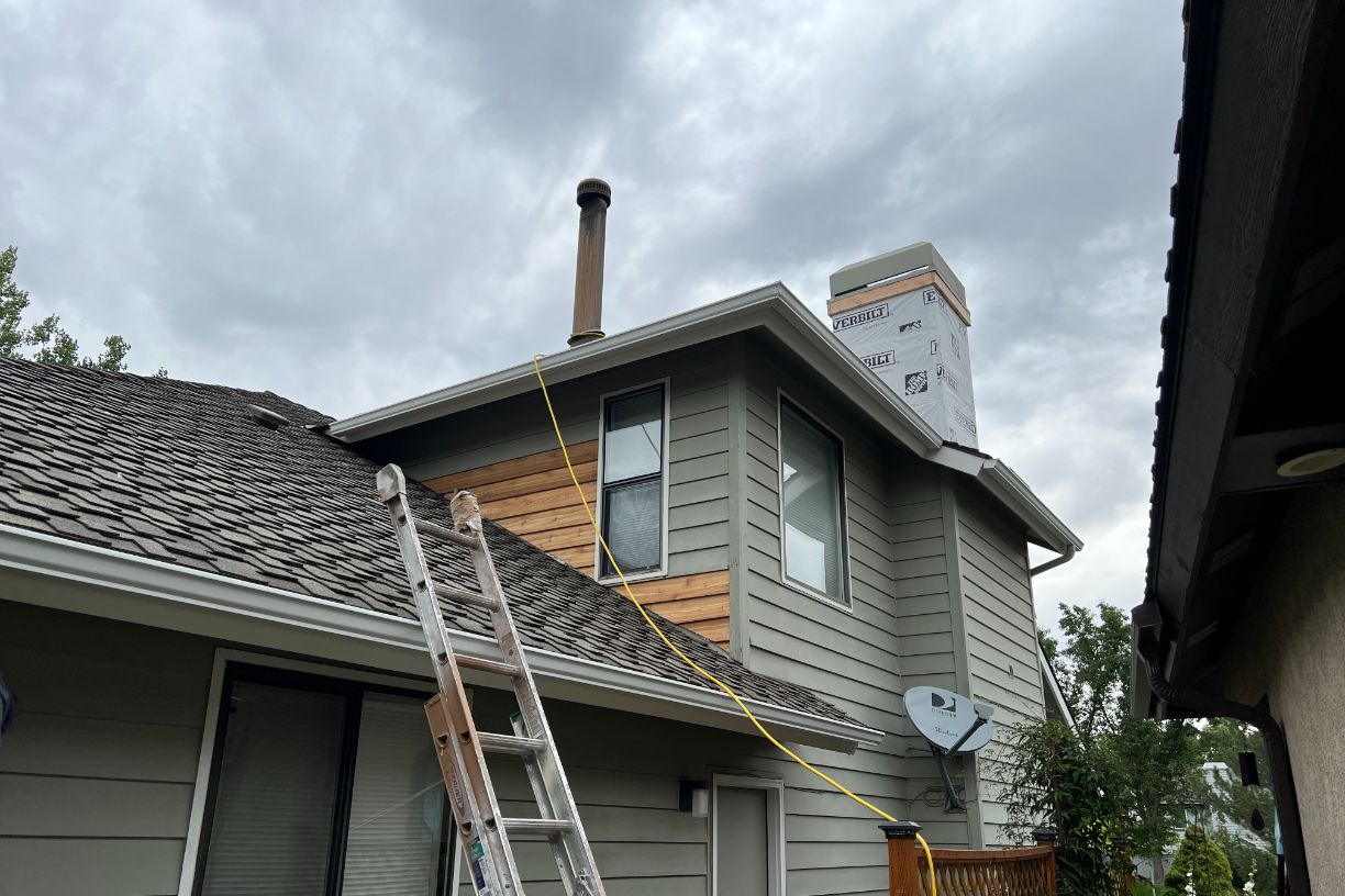 Chimney repair and siding replacement underway