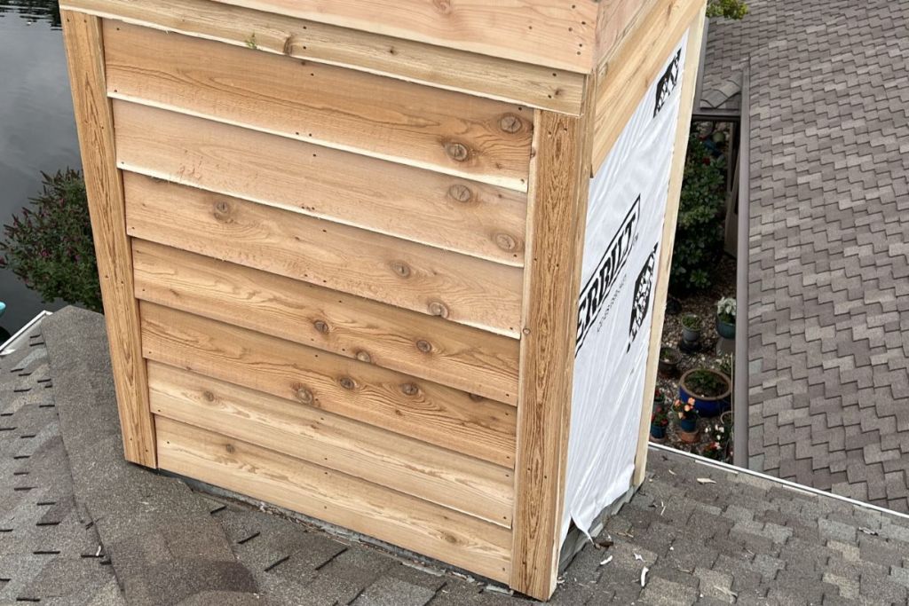 New cedar siding installed on chimney