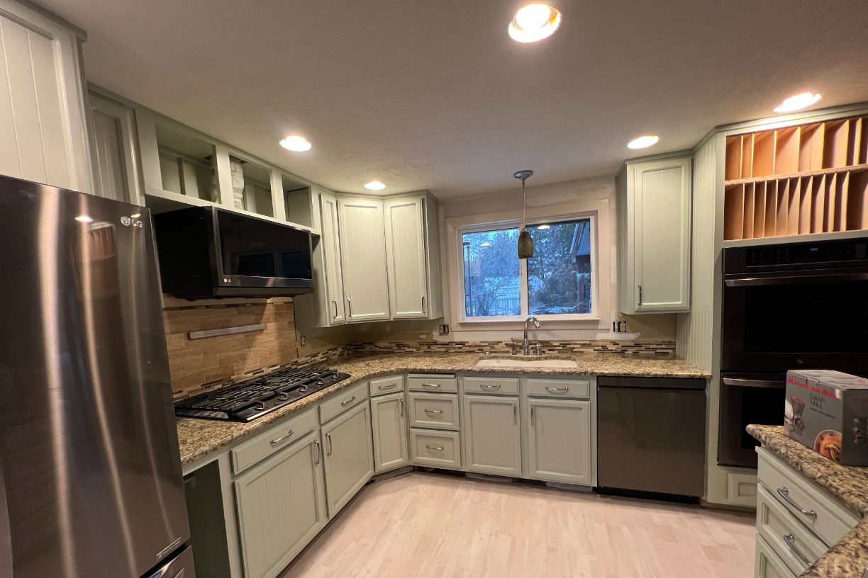 Kitchen cabinets painted soft green finish