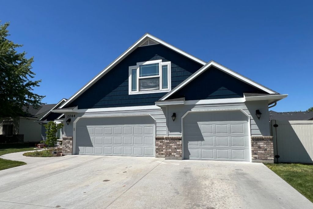 Modern suburban home with three garage doors