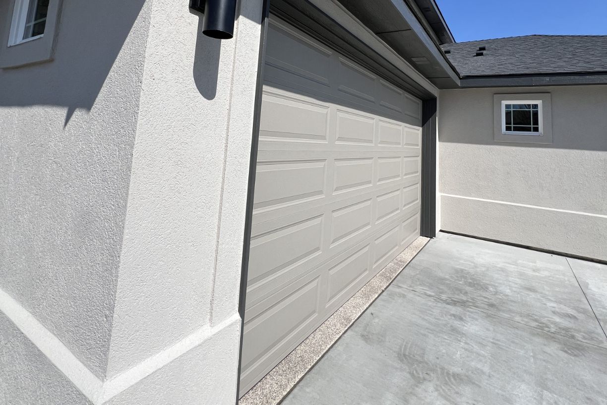 Modern garage exterior with clean stucco