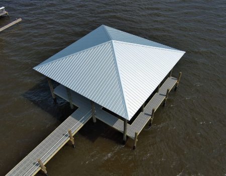 Covered wooden dock structure over water