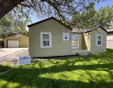 yellow house siding with new paint