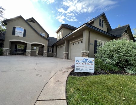 House exterior with painting company sign